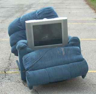 easy-chair-and-tv-with-bullet-hole-1